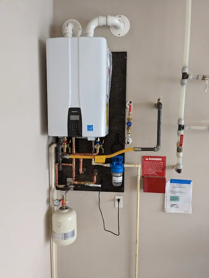 Professional plumber installing copper piping in a Pembroke Park home